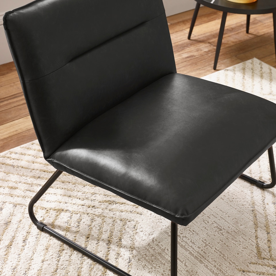 image 1 of Saxon Black Faux Leather Lounge Chair