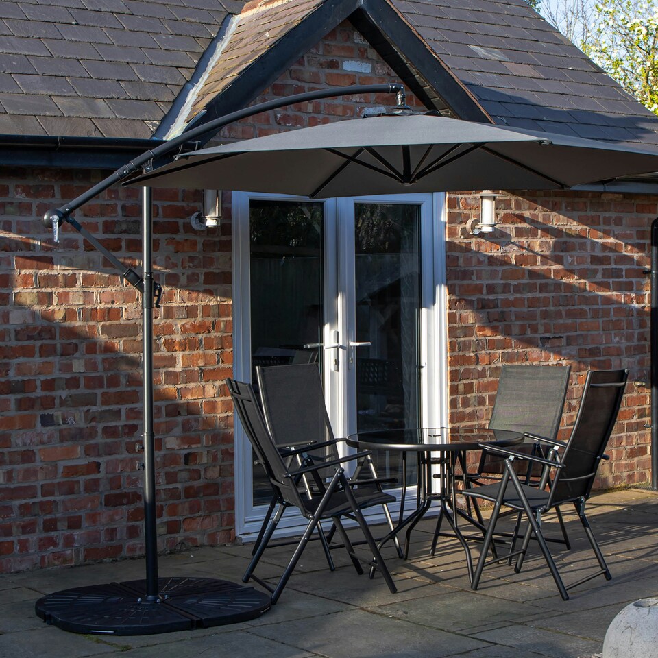 image 1 of Outdoor 4 Person Round Glass Top Garden Dining Table Chairs With Grey Banana Parasol and Base
