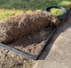image 4 of Flexible Black Plastic Garden Lawn Edging with 40 Pegs (10m) - 3 Rolls
