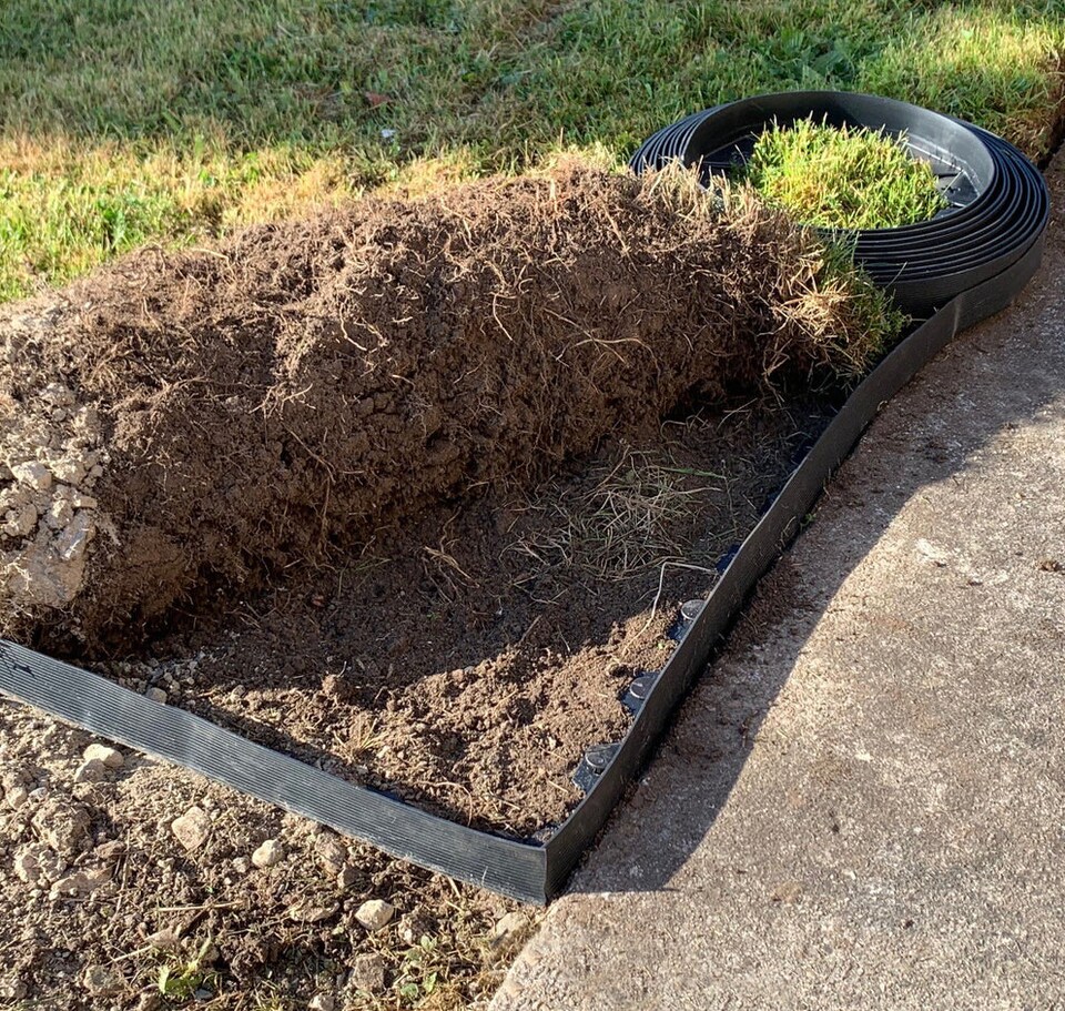 image 1 of Flexible Black Plastic Garden Lawn Edging with 40 Pegs (10m) - 3 Rolls