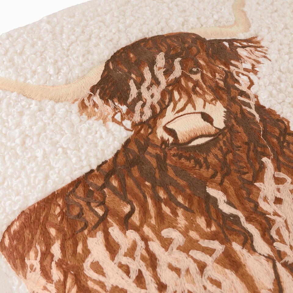 image 1 of Evans Lichfield Boucle Highland Cow Embroidered Cushion