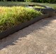 image 5 of Flexible Black Plastic Garden Lawn Edging with 40 Pegs (10m) - 3 Rolls