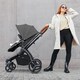 image 2 of Stomp Luxe 12pc Travel System with Stratus i-Size Car Seat & ISOFIX Base, Carrycot, Reversible Seat, Rain Cover & More (Black/Charcoal Grey/Tan)