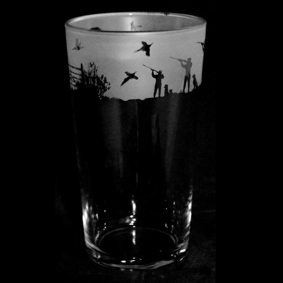 Animo Glass Etched Pint Glass Shooting