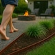 image 7 of Harbour Housewares Flexible Plastic Lawn Edging with 120 Pegs & Mallet - 30m x 4cm - Brown