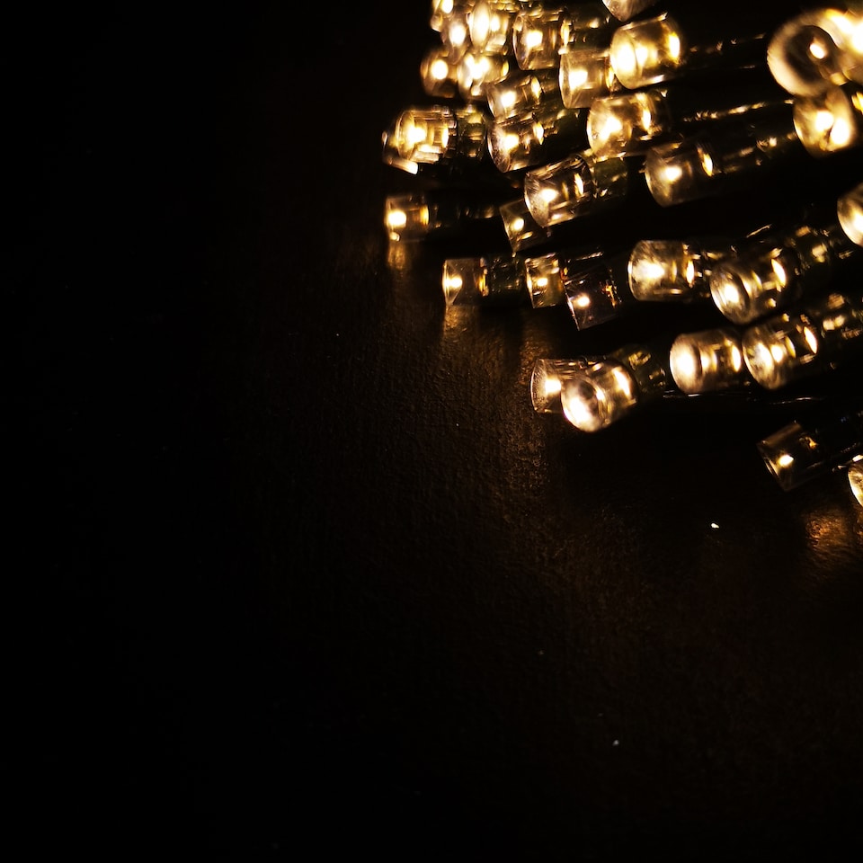 image 1 of 100 LED 10m Premier Christmas Outdoor Multi Function Battery Lights with Timer & Clear Cable in Warm White