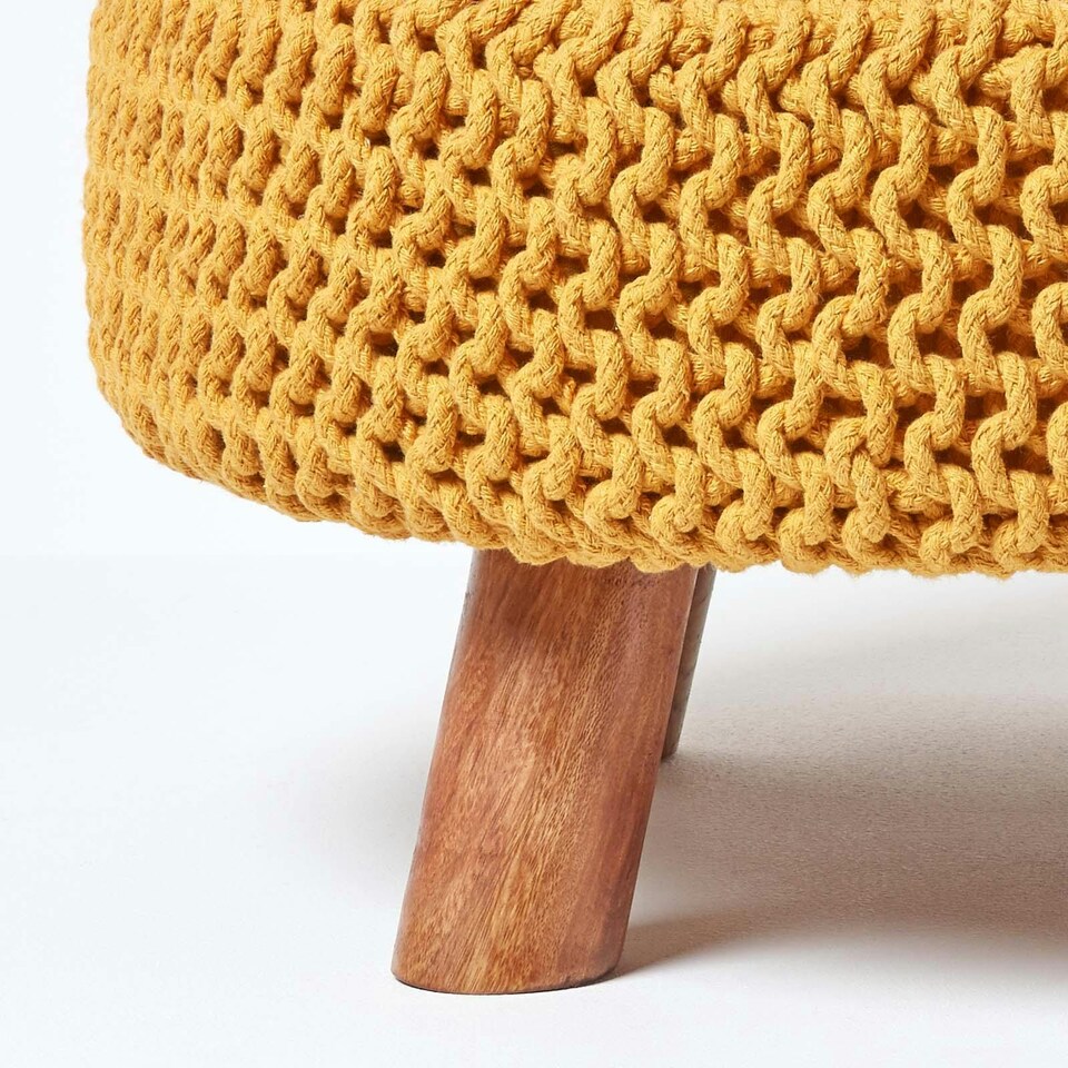image 1 of Homescapes Mustard Large Round Cotton Knitted Footstool on Legs | Yellow | 62 x 62 x 30 cm