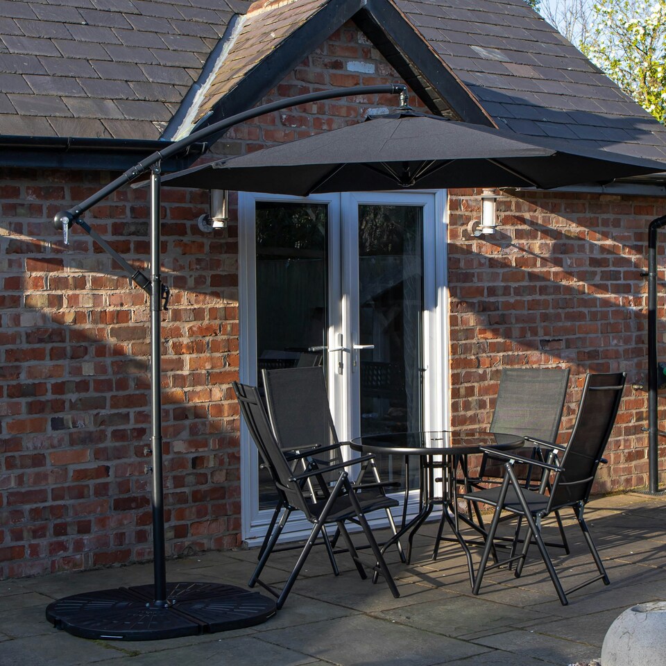 image 1 of Outdoor 4 Person Round Glass Top Garden Dining Table Chairs With Black Banana Parasol and Base