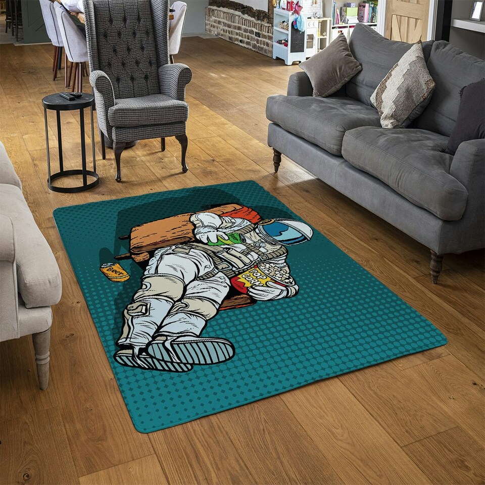 image 1 of Astronaut the audience with beer and popcorn sitting in a chair. loneliness in space. Pop art retro (Rug) Cream | XL