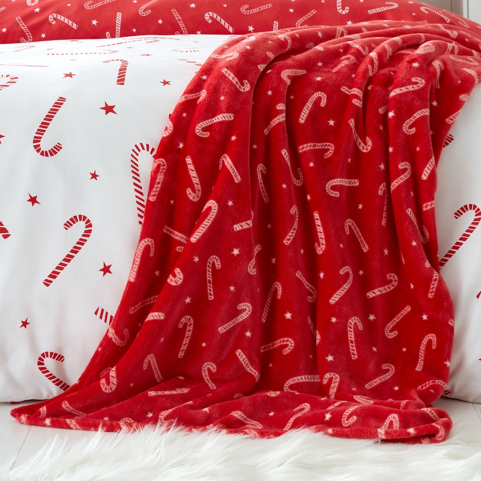 image 1 of Catherine Lansfield Christmas Candy Cane Cosy Fleece Blanket Throw