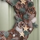 image 3 of 50cm Frosted Hanging Christmas Wreath with Pine Cones & Wooden Stars