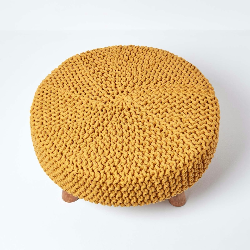 image 1 of Homescapes Mustard Large Round Cotton Knitted Footstool on Legs | Yellow | 62 x 62 x 30 cm