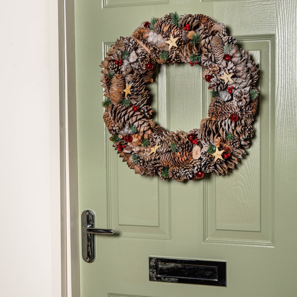 image 1 of 50cm Frosted Hanging Christmas Wreath with Red Jingle Bells & Wooden Stars