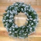 image 10 of 55cm Premier Christmas Snow Tipped Green Pine PVC Door Wreath
