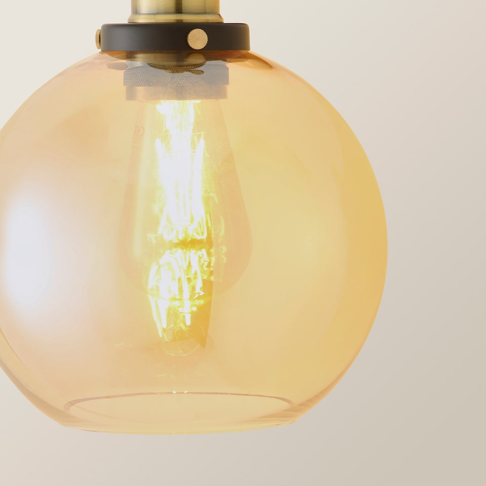 image 1 of ValueLights Sheridan Black Indoor Wall Lantern Amber Glass Shade | Orange