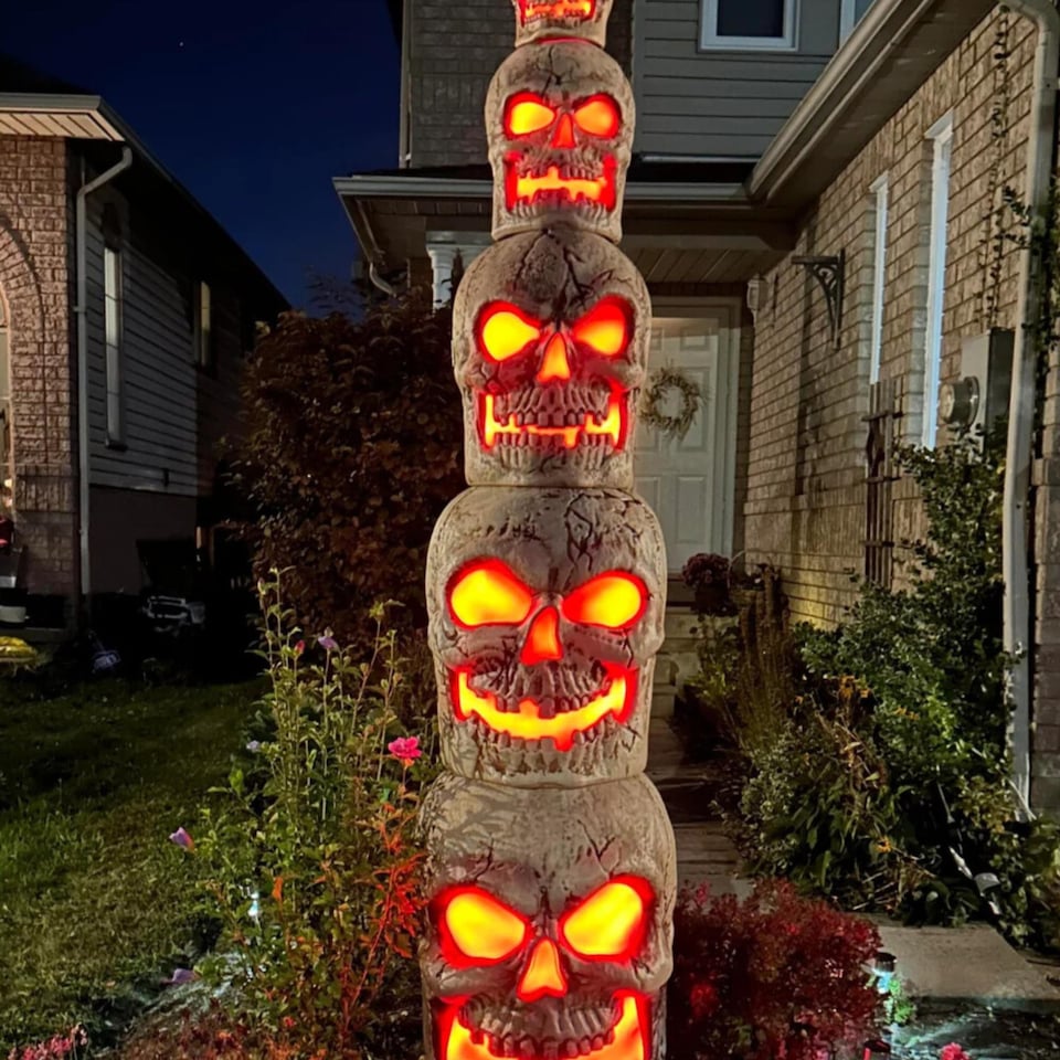 image 1 of Home Accents Holiday 8ft Giant-Sized Halloween Skull Stack with Red LEDs