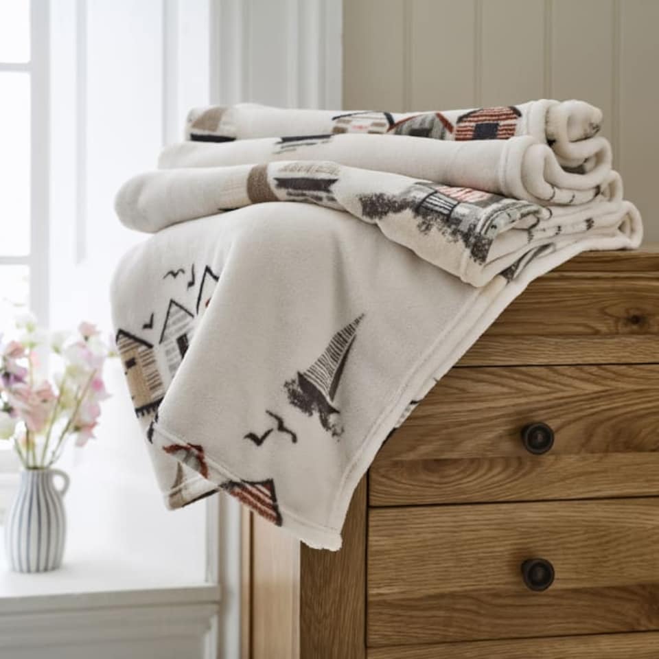 image 1 of Sheringham Soft Coral Fleece Printed Throw