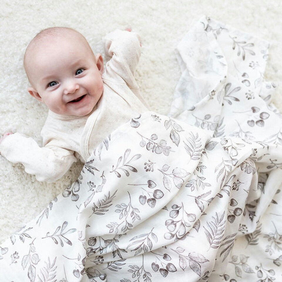 image 1 of The Gilded Bird XL Muslin Swaddle - Lovely Leaves Grey