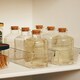 image 4 of Interiors by Premier Functional Design Set Of 6 Round Glass Bottles, Glass Bottles For Kitchen, Versatile Use Clear Glass Bottles