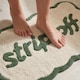 image 4 of Strip Off Slogan Scalloped Bath Mat