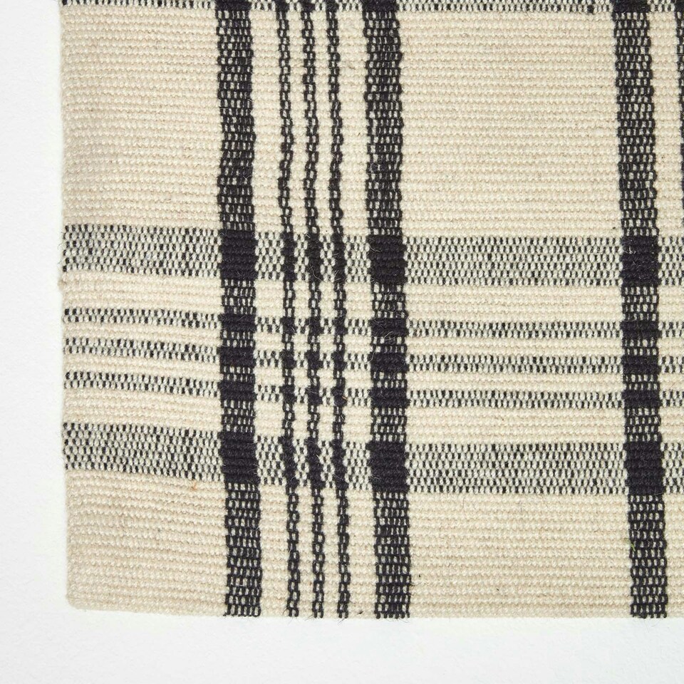 image 1 of Homescapes Logan Black and White Tartan Check Non-Slip 100% Wool Rug - 70 x 120 cm Black | 70 x 120 cm