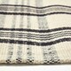 image 4 of Homescapes Logan Black and White Tartan Check Non-Slip 100% Wool Rug - 70 x 120 cm Black | 70 x 120 cm