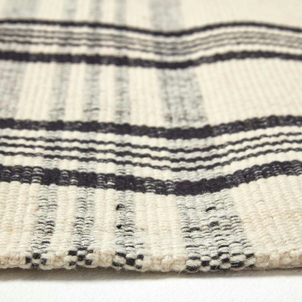 image 1 of Homescapes Logan Black and White Tartan Check Non-Slip 100% Wool Rug - 70 x 120 cm Black | 70 x 120 cm