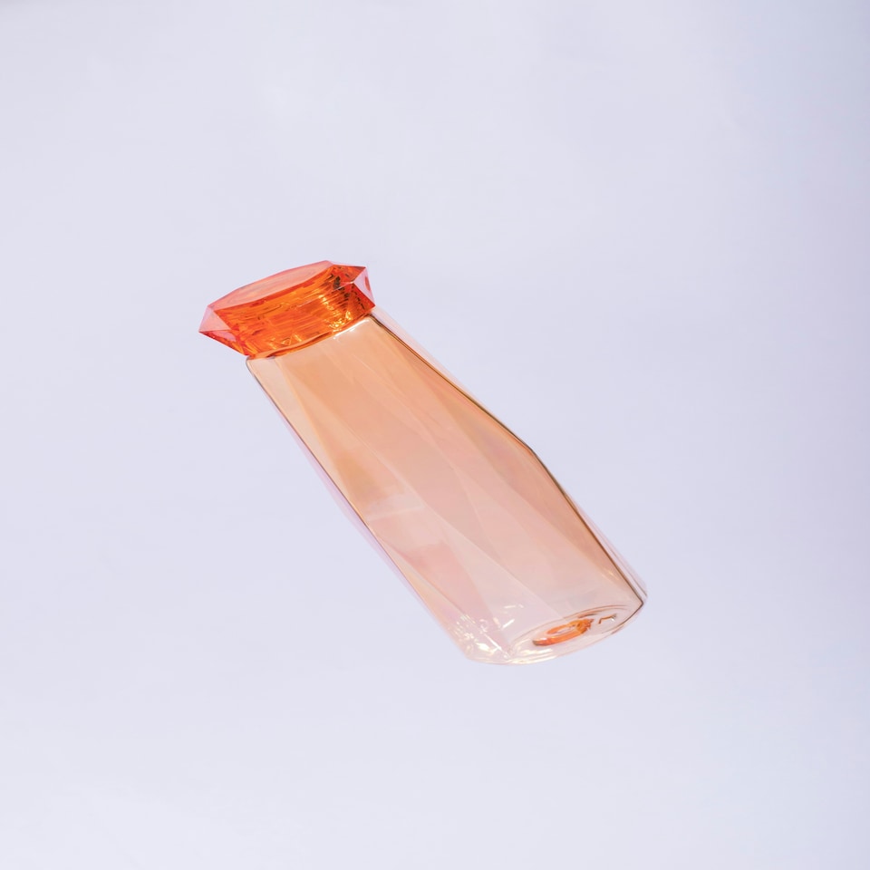 image 1 of Interiors by Premier Orange Plastic Water Bottle, 600ml Diamond Patterned Modern Water Bottle For Daily Use, Clear Water Bottle