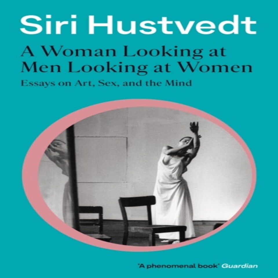 A Woman Looking At Men Looking At Women