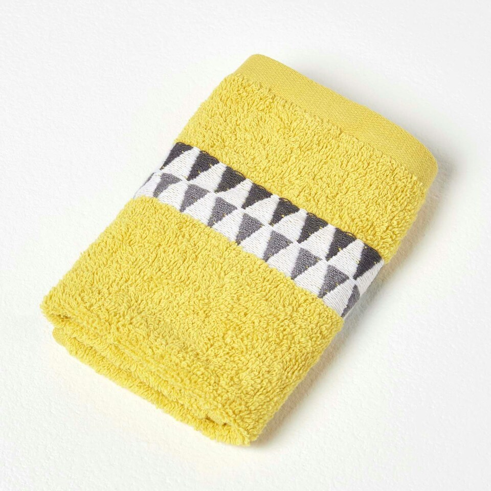 image 1 of Homescapes Geometric 100% Cotton Face Cloth - Ochre Yellow | Face cloth