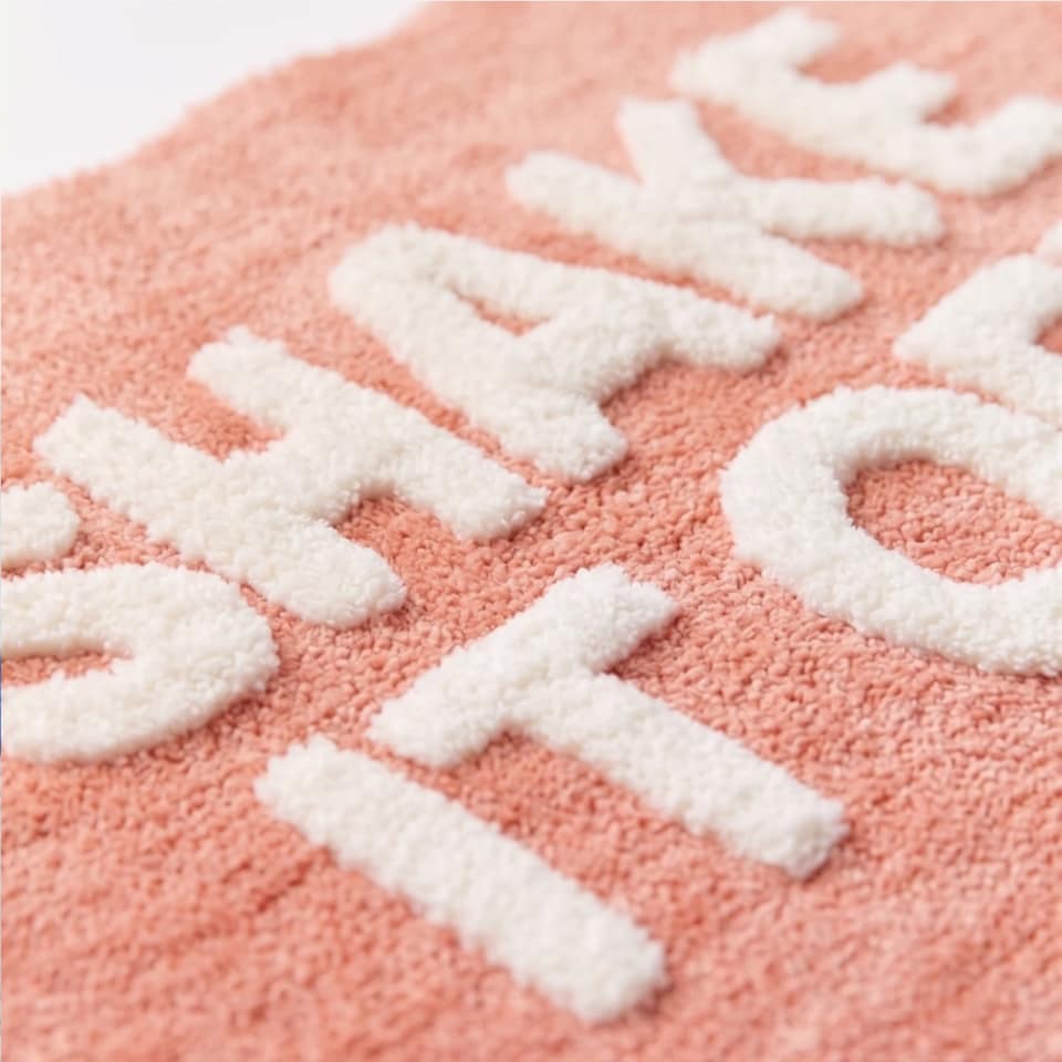 image 1 of Shake It Off Slogan Scalloped Bath Mat