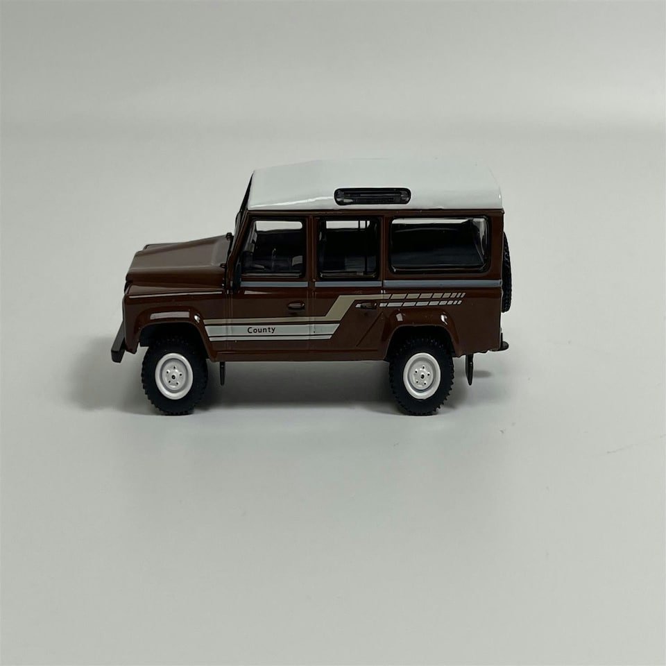 image 1 of Land Rover Defender 110 1985 County Station Wagon Russet Brown LHD 1:64 Mini GT MGT00734L