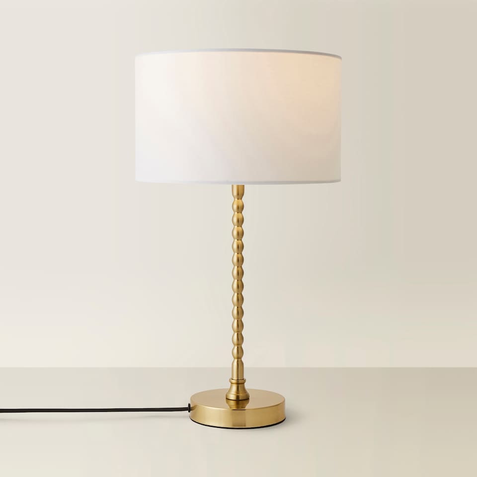 image 1 of ValueLights Maeve White Fabric Drum Lamp Shade Brushed Gold Bobbin Bobble Table Lamp | Gold