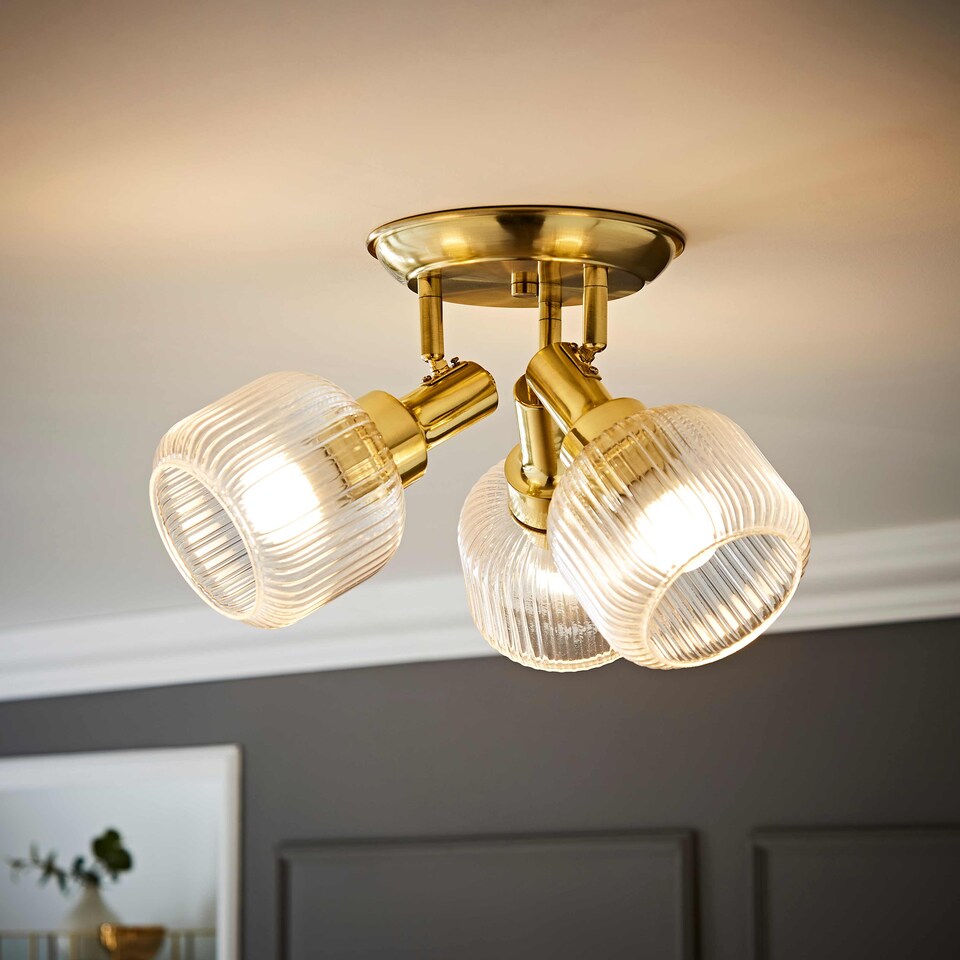 image 1 of ValueLights Calpe 3 Way Brass Ceiling Spotlight Ribbed Clear Shades | Bronze