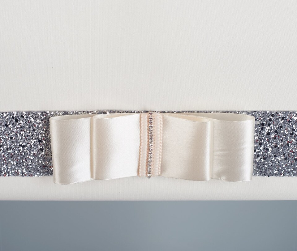 image 1 of FURNISHED Blackout Roller Blind with Gold Glitter Trim and Cream Bow Cut to Size | Cream | Cream | (W) 180cm x (L) 210cm