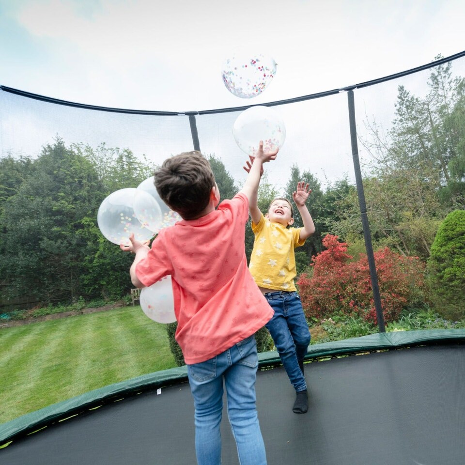 image 1 of 15ft x 10ft JumpPRO® Xcite Green Oval Trampoline with Enclosure - 86 Springs, 150kg Capacity.