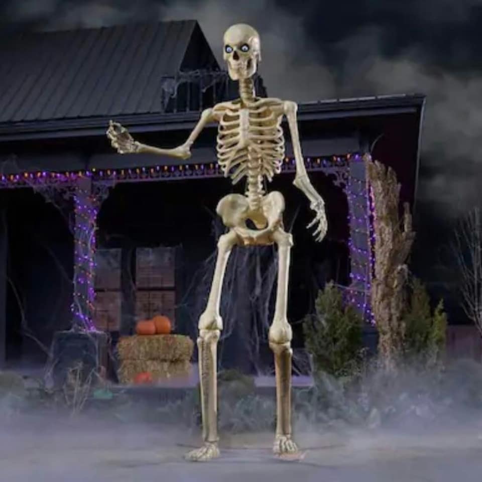 image 1 of Home Accents Holiday 12ft Standing Giant Halloween Skeleton with LCD Eyes and Posable Arms