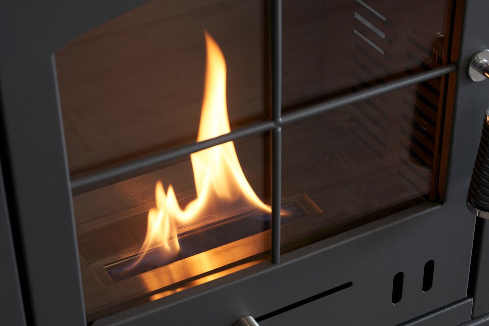 image 1 of OKO S2 Bio Ethanol Stove with Log Storage in Charcoal Grey with Angled Stove Pipe