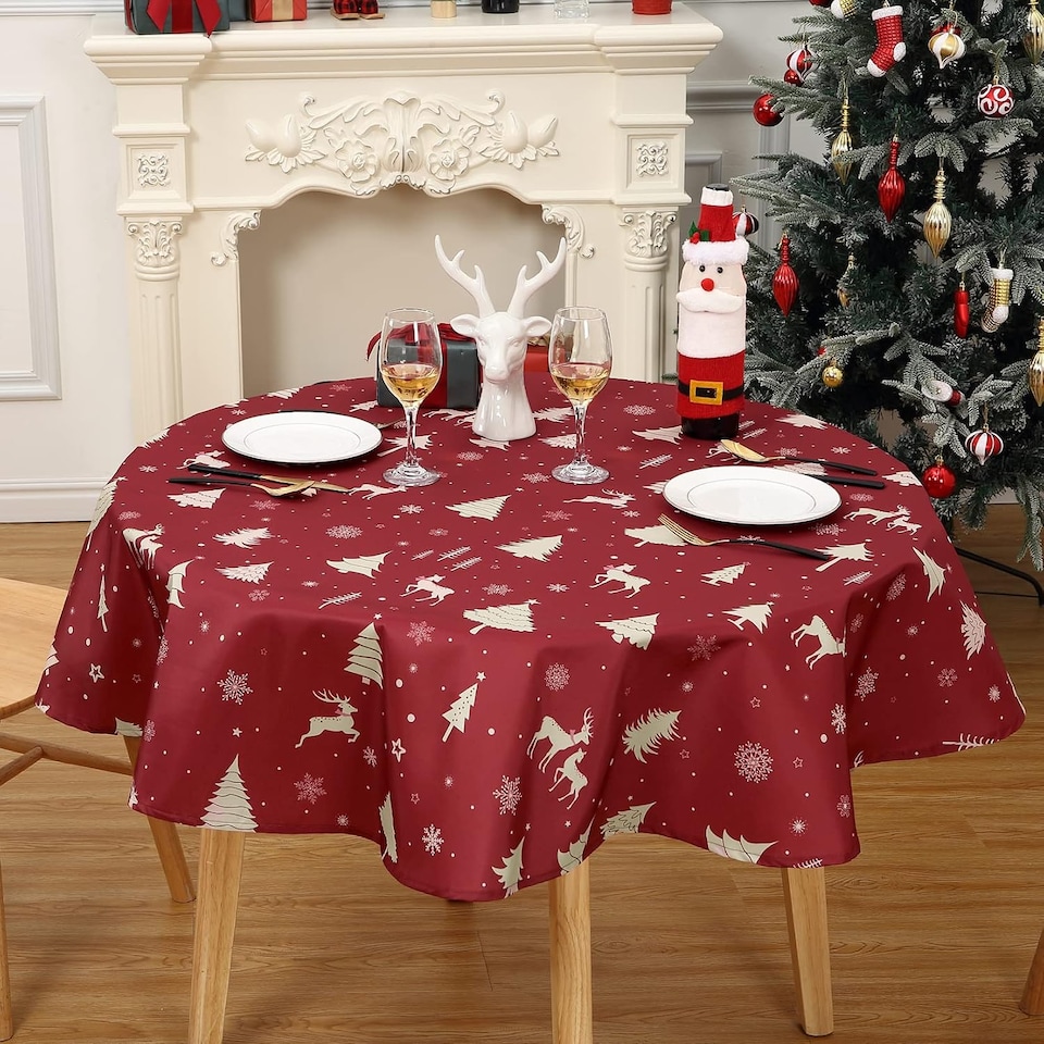 image 1 of London Boutique Round Christmas Tablecloth, Waterproof Washable, Deer Festive Print, Red‑Gold, 60 x 60 in