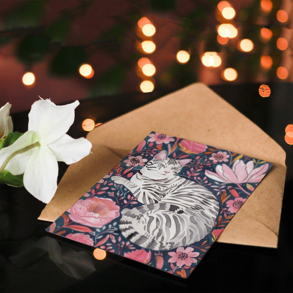 image 1 of Greeting Card Striped Cat Laying in Pink Wildflowers Watercolour