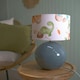 image 2 of ValueLights Bosco Eucalyptus Ceramic Table Lamp with Dinosaur Drum Shade Green