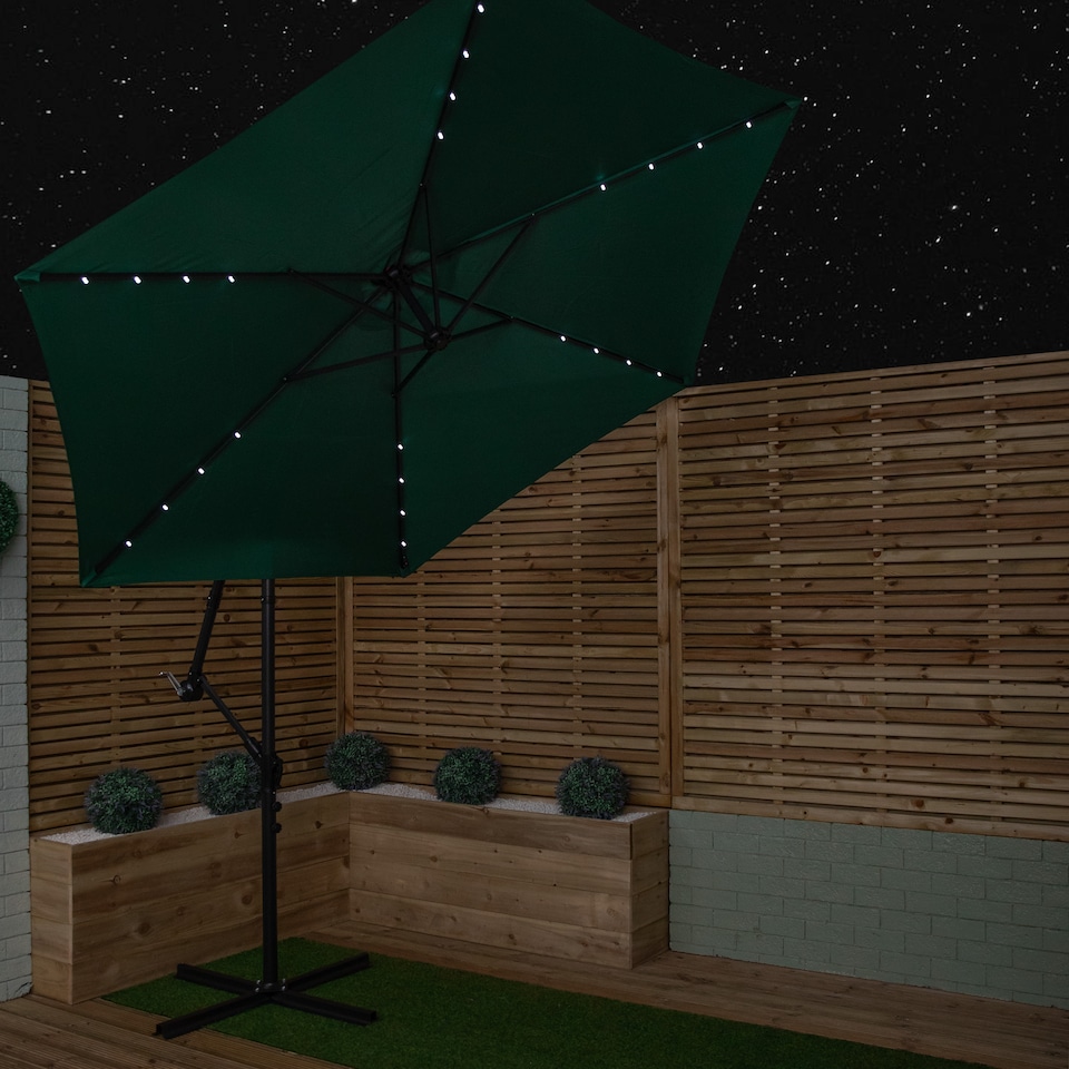 image 1 of Samuel Alexander 3m Solar Powered Cantilever Lit Banana Garden Parasol with Crank Handle & White LED Lights in Green
