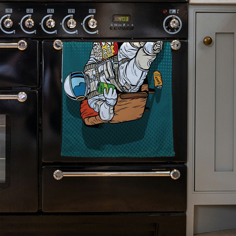 image 1 of Astronaut the audience with beer and popcorn sitting in a chair. loneliness in space. Pop art retro (Kitchen Towel)