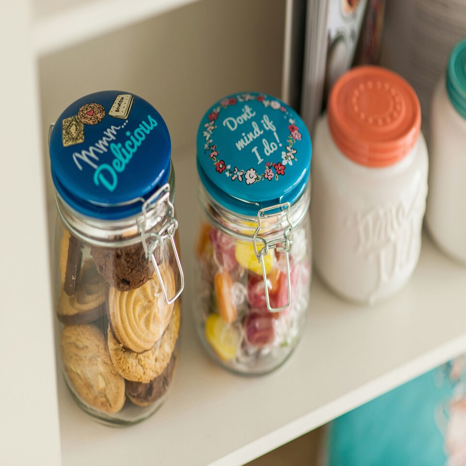 image 1 of Interiors By Premier Pretty Things Glass Jar 1000ml, Clear Glass Storage Jar with Blue Ceramic Clip Top Lid