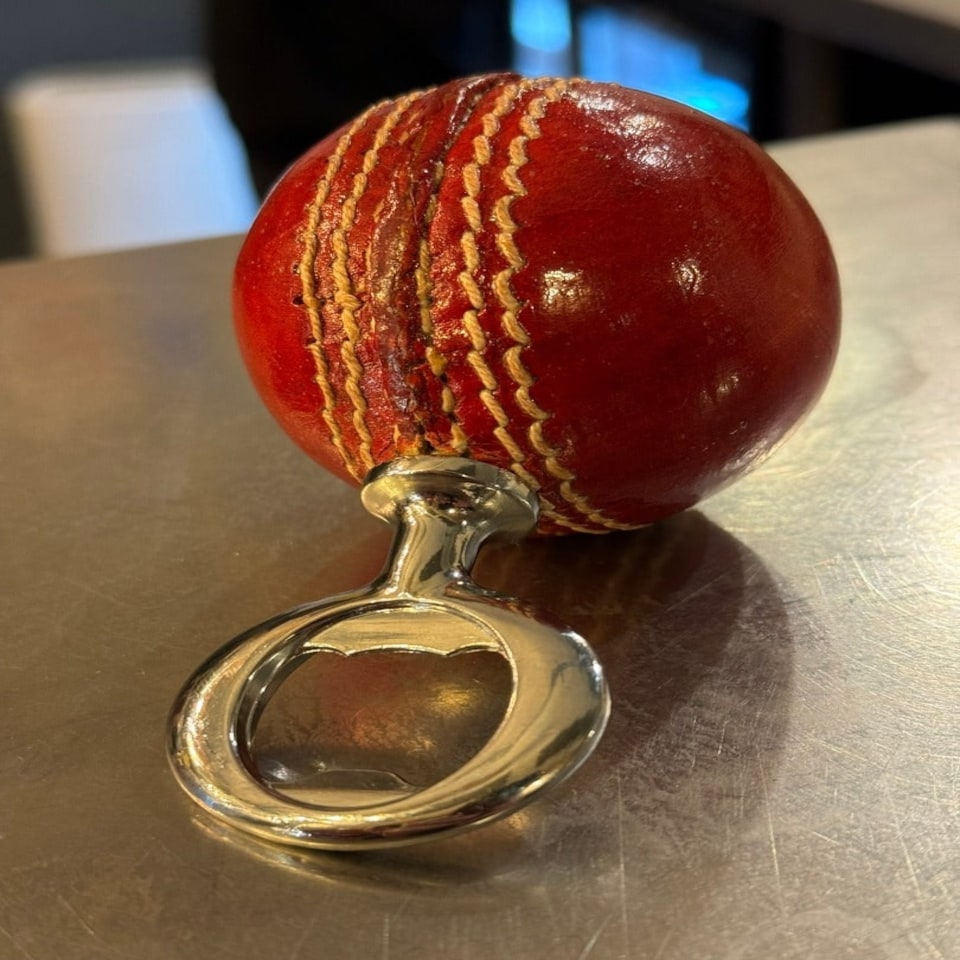 image 1 of CRICKET-GIFTS - Real Cricket Ball Bottle Opener | Made from Genuine Leather | For Cricket Fans | Unique Bar Accessory | Handmade and Designed in the UK
