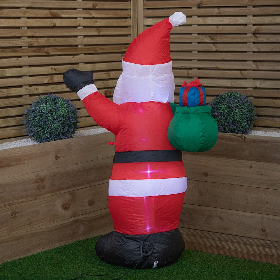 image 1 of 130cm (4ft) Inflatable LED Outdoor Christmas Standing Santa with Gift in Sack