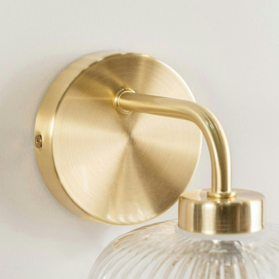 image 1 of ValueLights Amaia Brushed Gold IP44 Single Clear Ribbed Glass Wall Light with LED Bulbs