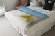 image 4 of dune fence by sea grass with sailboat on horizon Designer Blanket | Multi