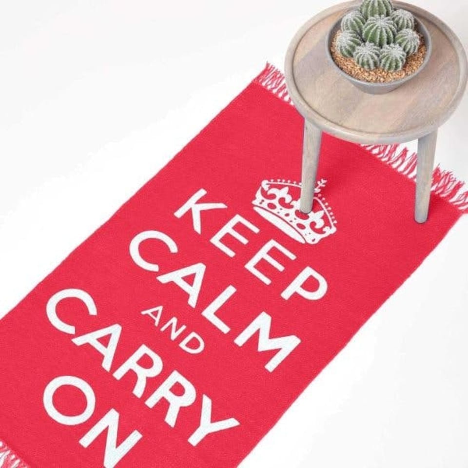 image 1 of Homescapes Keep Calm And Carry On Handwoven Cotton Rug in Cream & Red - 60 x 100 cm | Red | Cream & red