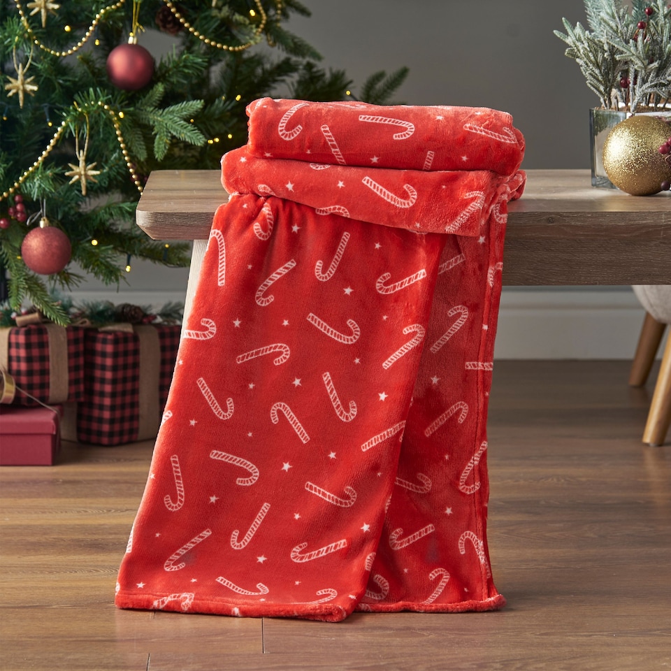 image 1 of Catherine Lansfield Christmas Candy Cane Cosy Fleece Blanket Throw